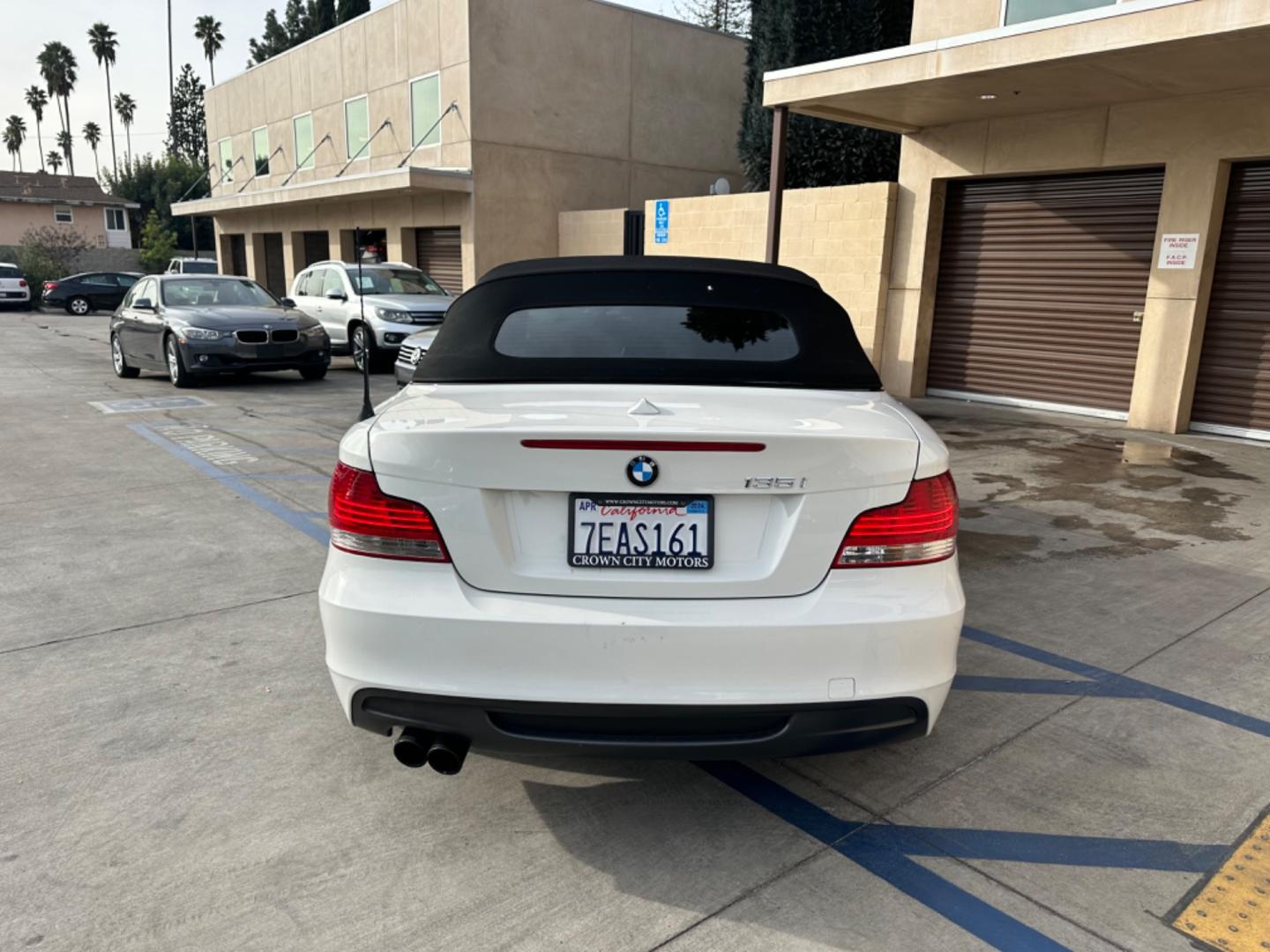 2011 WHITE /Black BMW 1-Series 135i Convertible (WBAUN7C56BV) with an 3.0L L6 DOHC 24V engine, Automatic transmission, located at 30 S. Berkeley Avenue, Pasadena, CA, 91107, (626) 248-7567, 34.145447, -118.109398 - Experience the Ultimate Driving Pleasure: 2011 BMW 135i Convertible Now Available in Pasadena, CA Discover the thrill of open-air driving with the 2011 BMW 135i Convertible, a perfect blend of luxury and performance, now featured at our BHPH dealership in Pasadena, CA. This exquisite convertible - Photo#3